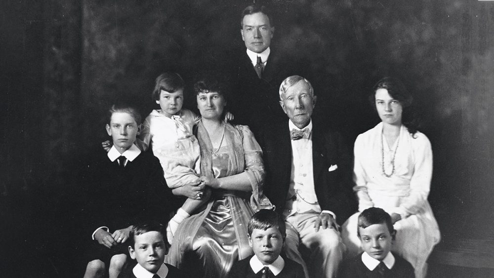 John D. Rockefeller, Sr. and his son John, Jr. leave a wedding in